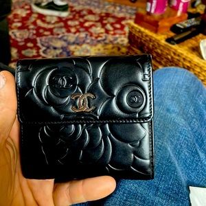 2013 Chanel Black Camellia Rose bifold with silver lining. Unused